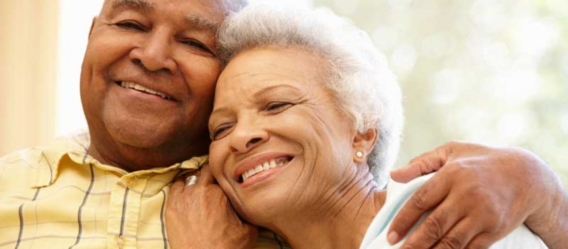 couple smiling after chrome guided dental implant surgery