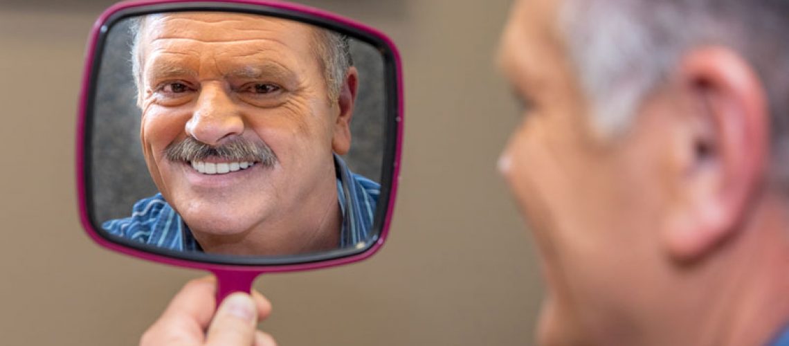 Dental Implant Patient Smiling At His New Dental Implants