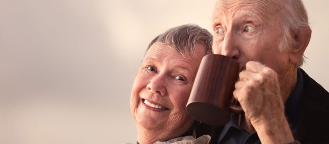 image of older people smiling with dental implants.