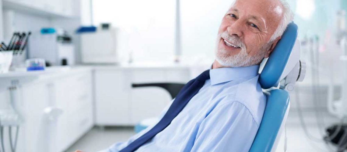 a patient smiling after his dental treatment with sedation