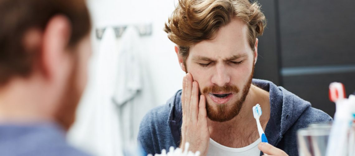 Dental Implant Patient Undergoing Mouth Pain