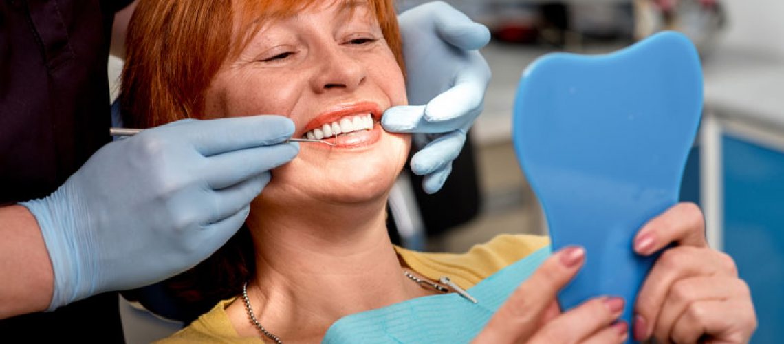 Dental Patient Smiling During Her Full Arch Dental Implant Patient